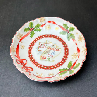 A festive white ceramic plate with scalloped edge and holiday design from decorbites christmas tableware set