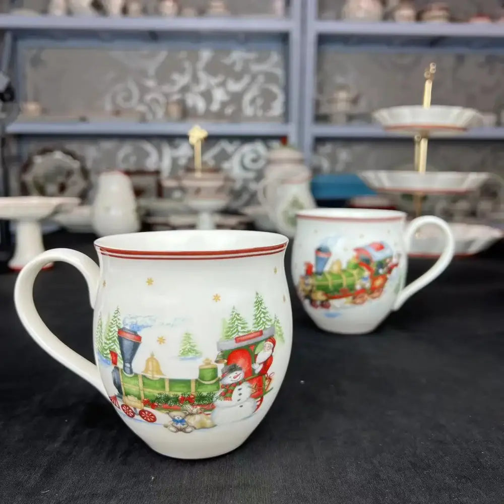 White ceramic mug with red rim featuring a festive christmas train scene from decorbites christmas tableware set