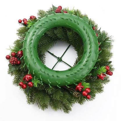 Green plastic wreath form with artificial pine needles and red berries for decorbites christmas tree decor