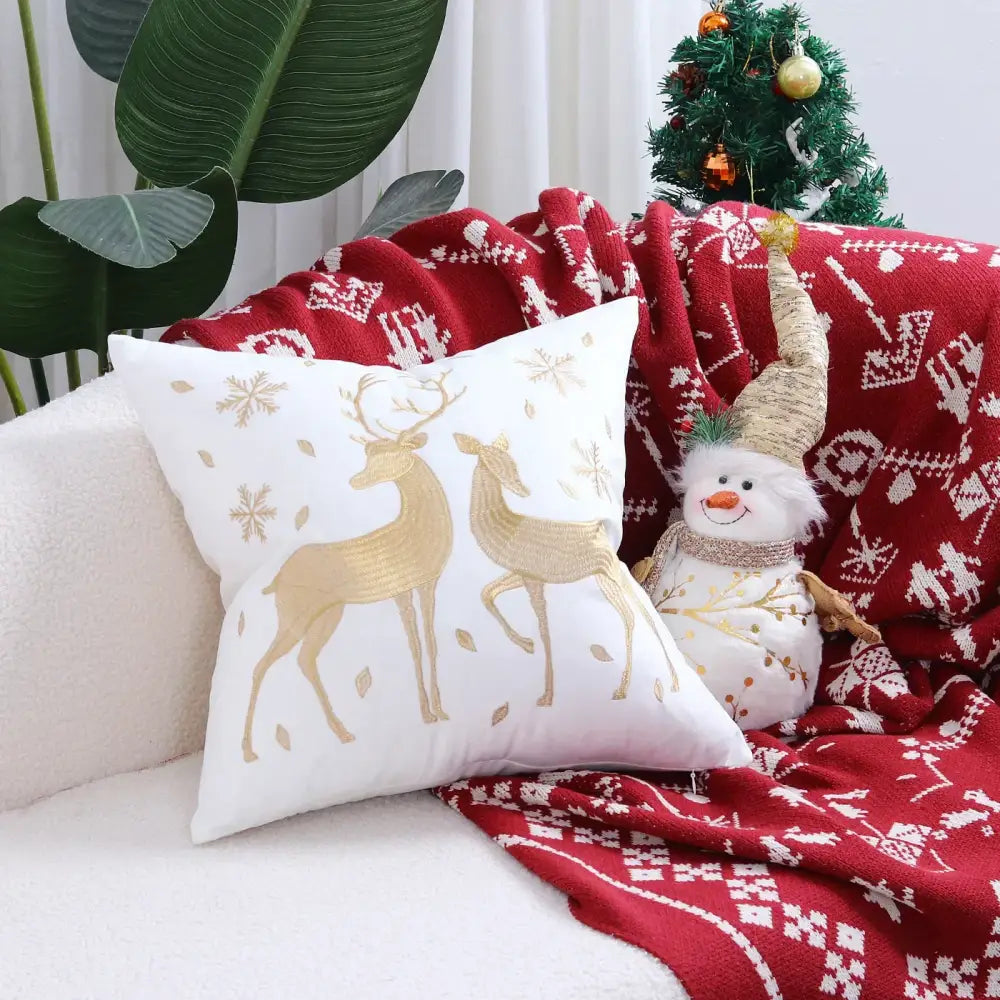 White pillow cover with embroidered gold deer and snowflake patterns designed for christmas tree festive decor cushion cover