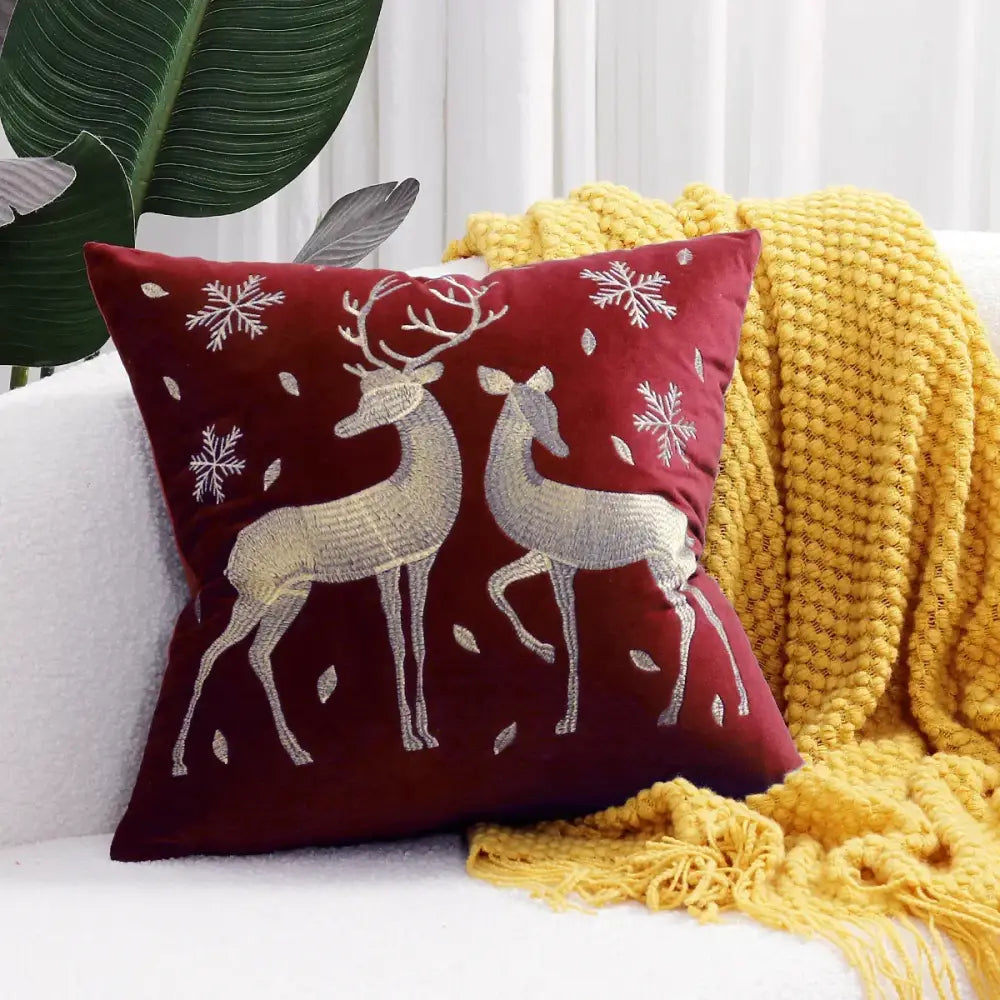 Burgundy velvet DecorBites™ cushion cover with embroidered silver deer and snowflakes for christmas tree decor
