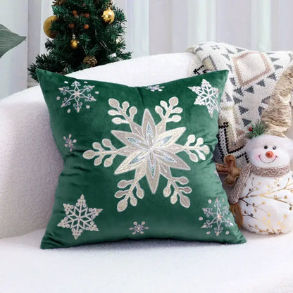 Emerald green velvet cushion cover with intricate silver and white embroidered snowflakes for christmas tree decor