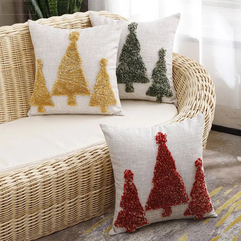 Three decorbites christmas tree pillow covers with textured gold green and red embroidery on beige linen fabric