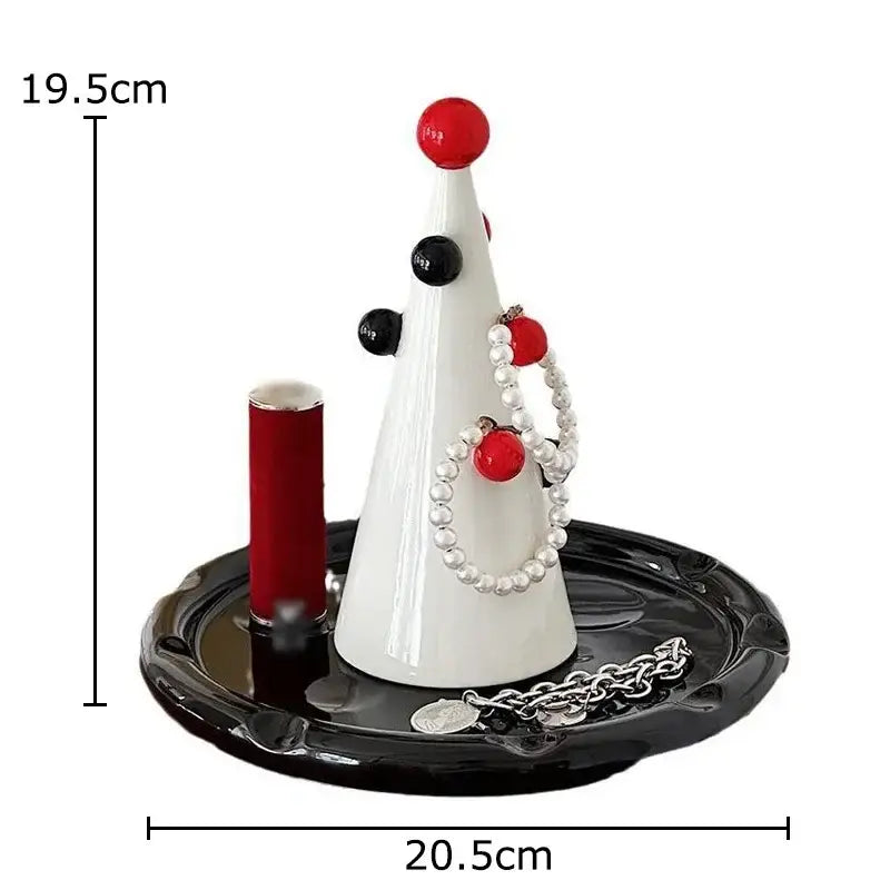 White ceramic christmas tree jewelry stand by DecorBites with red ornaments and pearl necklace on black base display