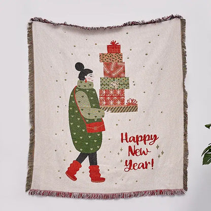 A cream-colored decorbites christmas tree knitted throw blanket with fringed edges and festive holiday illustration
