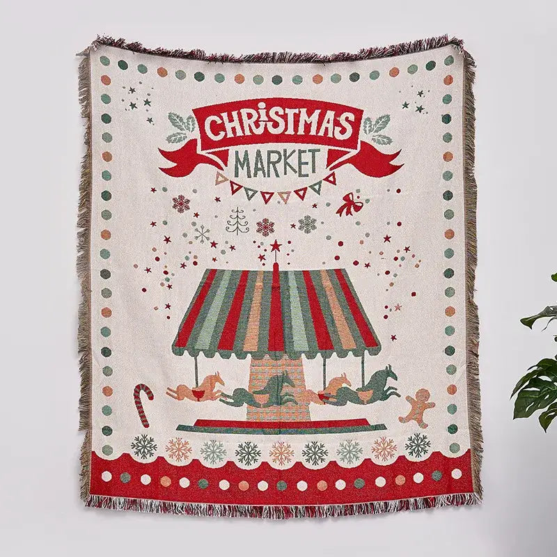 Festive cream colored decorbites christmas tree knitted throw blanket with christmas market design and bold red lettering