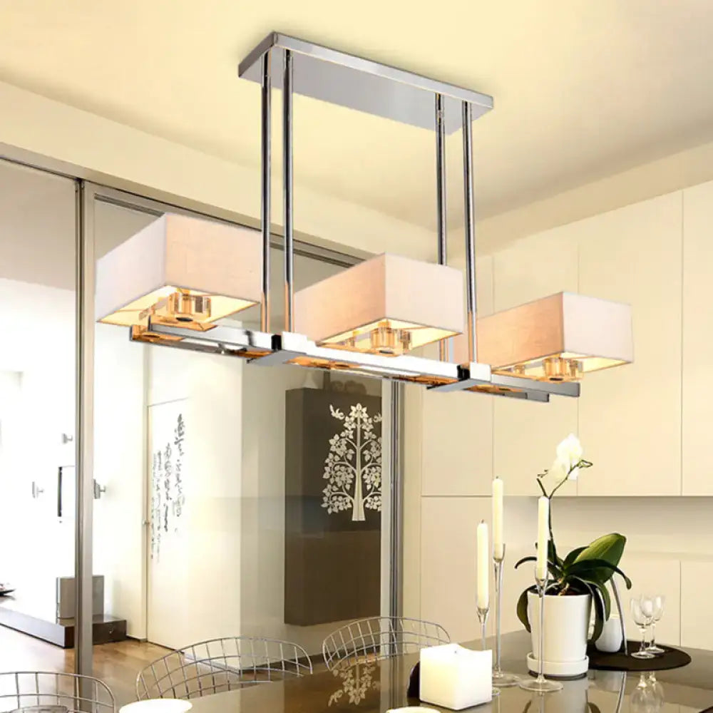 Modern chrome-finished pendant light with rectangular fabric shades in beige for dining room warm lighting decor
