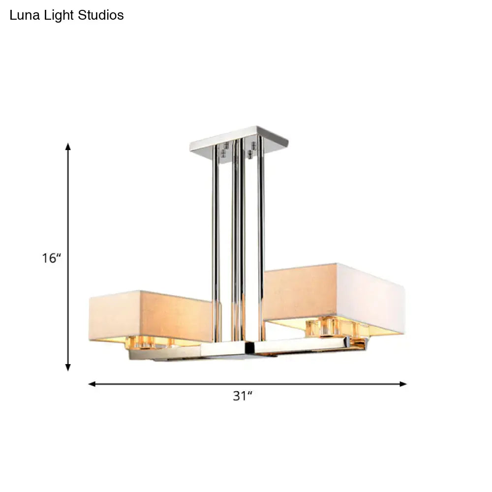 Modern chrome pendant light with two rectangular beige fabric shades designed for dining room use by decorbites