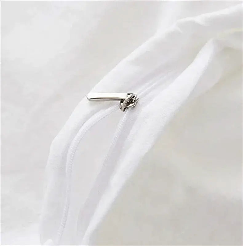 Silver zipper pull on white fabric of DecorBites™ cinnamoroll duvet cover in cute home decor bedding set