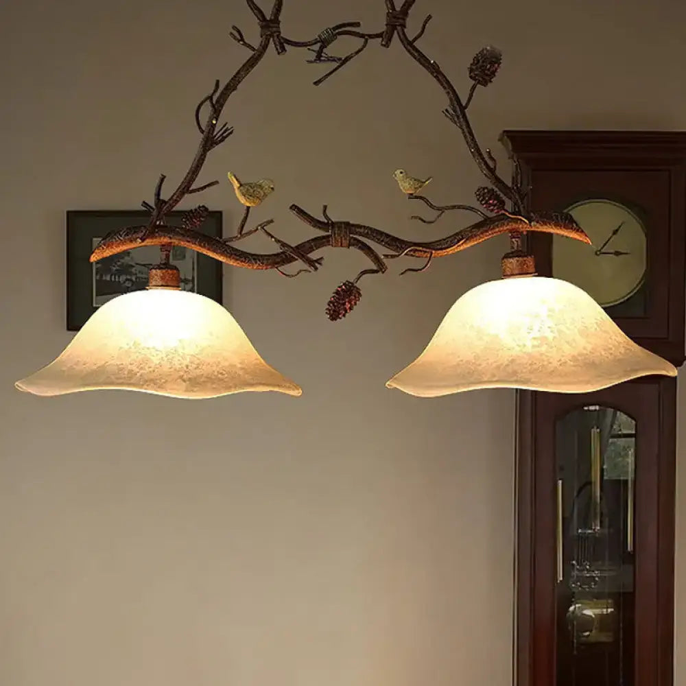 Rustic bronze decorbites classic 2-head resin branch suspension light with frosted scalloped shades pinecones and birds