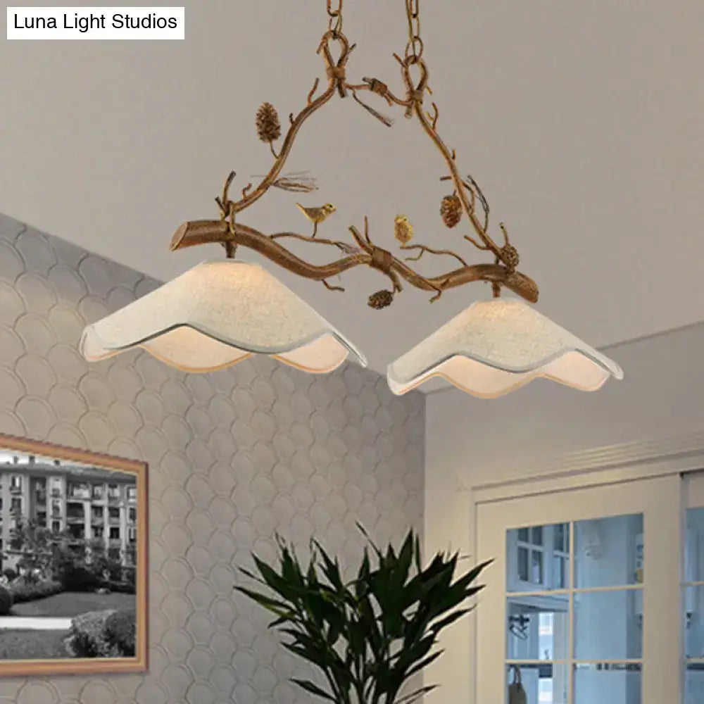 Decorbites classic resin branch suspension light in antique bronze with two scalloped off-white glass shades and pinecone details