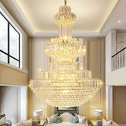 A decorbites classic crystal chandelier with clear and gold-toned glass tiers suspended in an elegant living room