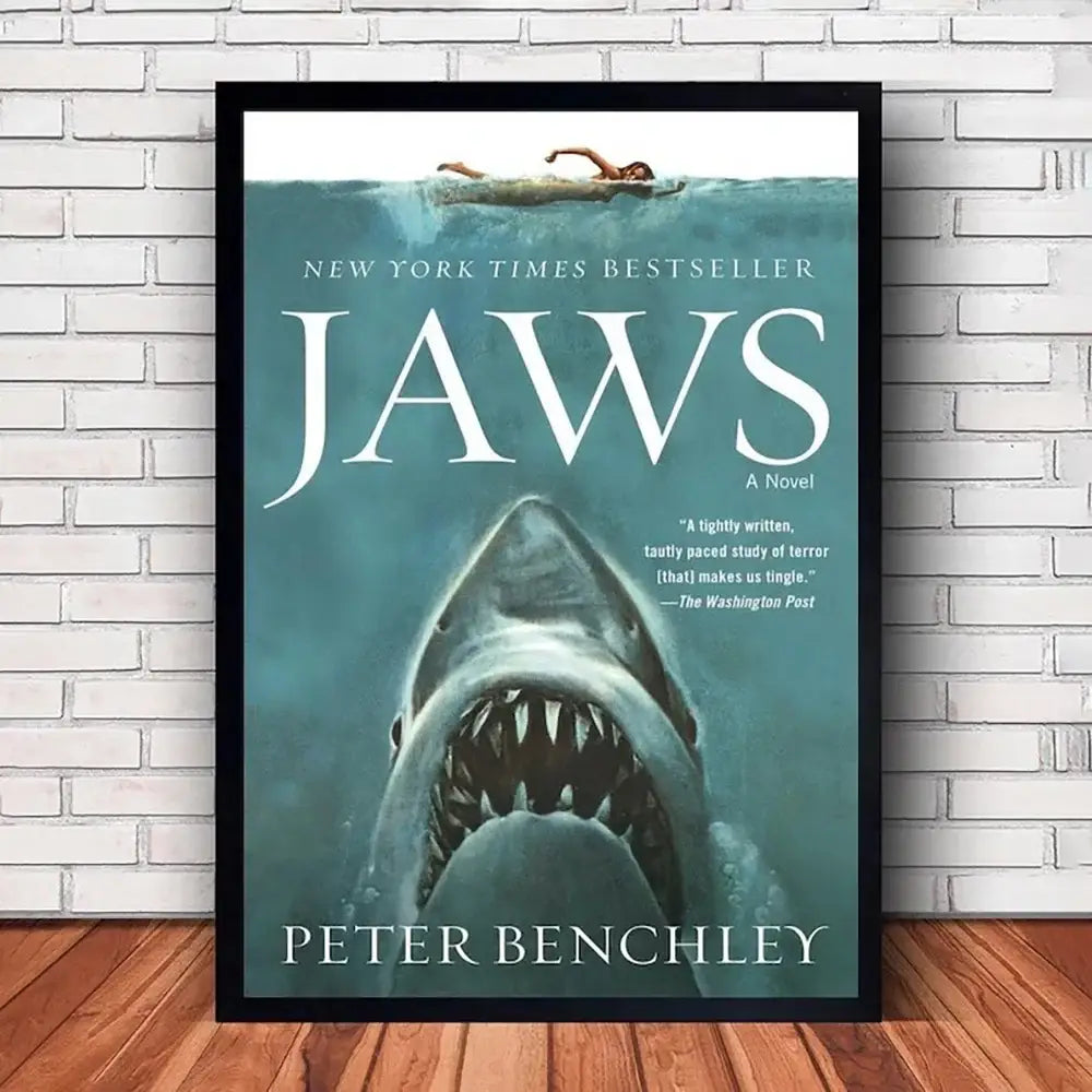 Black-framed teal jaws movie poster canvas featuring a shark’s open mouth and swimmer by decorbites classic wall art
