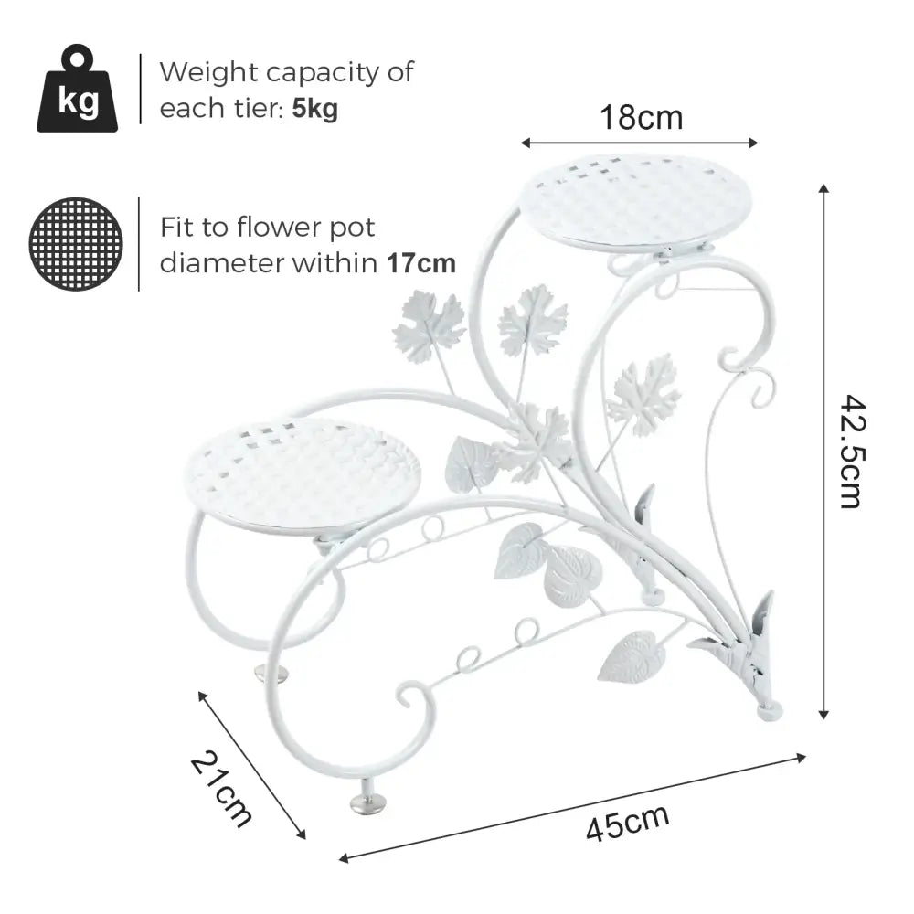White wrought iron classic tall plant stand with decorative leaf and vine motifs and three tiers for indoor outdoor use