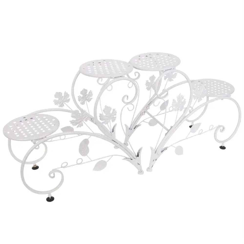 White wrought iron classic tall plant stand with floral and leaf motifs and five perforated circular shelves by DecorBites