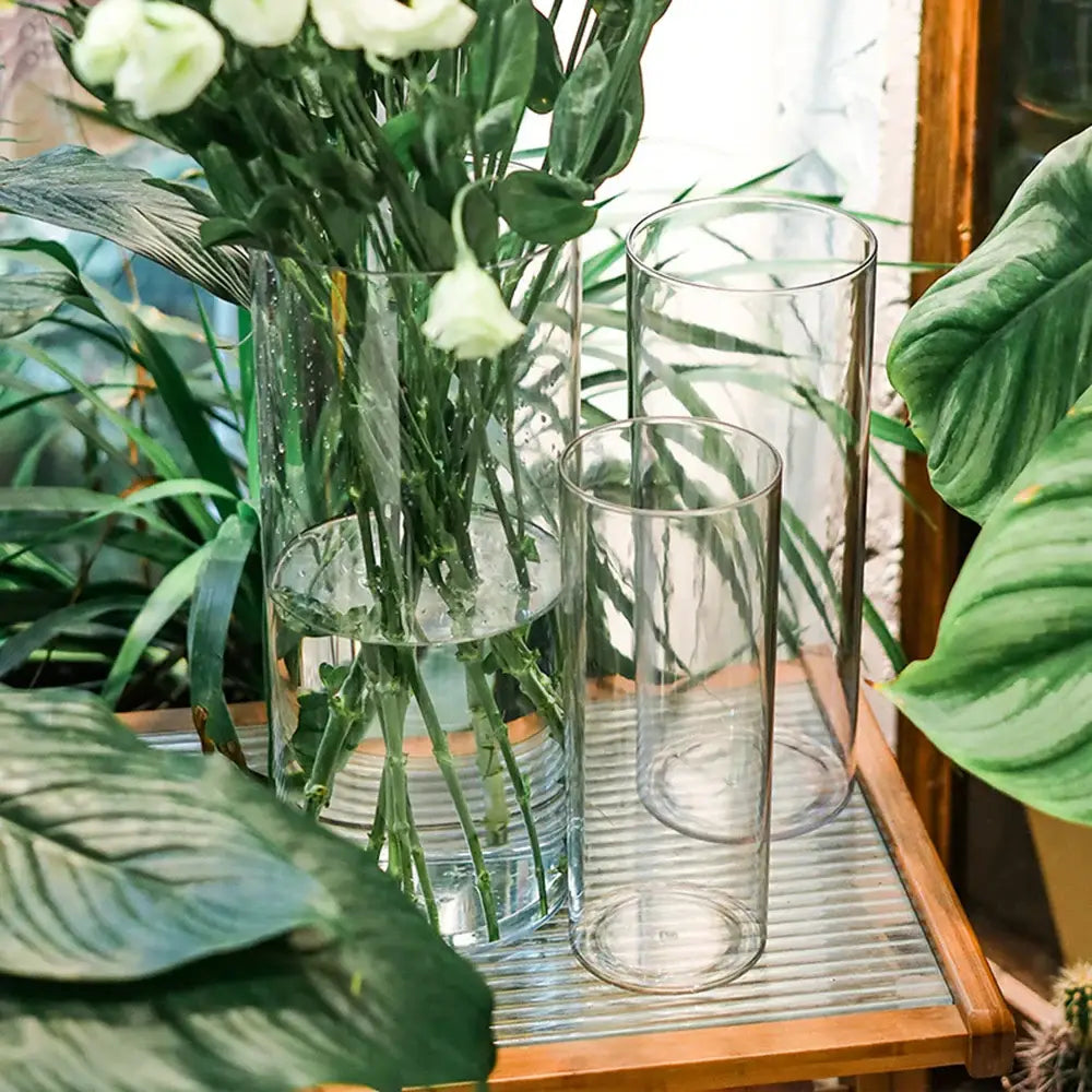 Decorbites™ clear acrylic hurricane flower vase large size featuring clear cylindrical design with white flowers and water visible