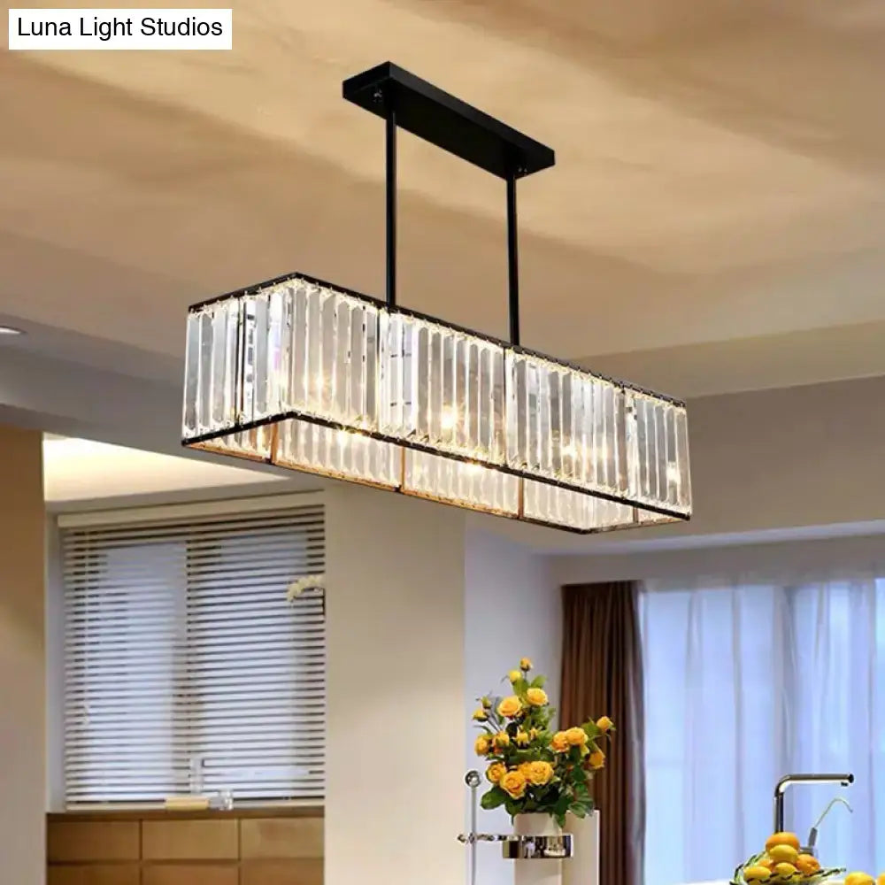Rectangular crystal island pendant light with black metal frame and clear hanging rods for living room ceiling