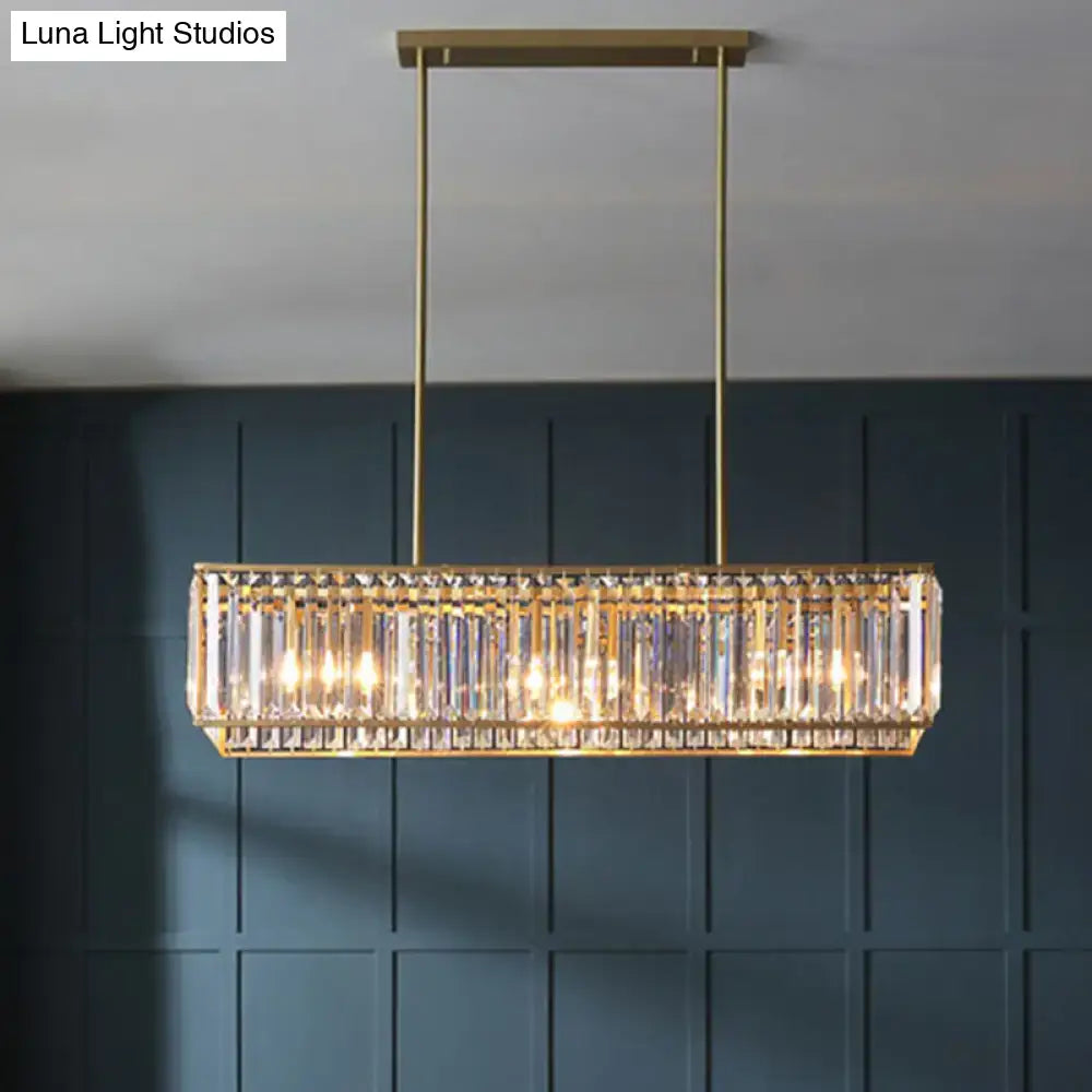 Gold-toned clear crystal island pendant light with vertical rods and minimalistic rectangular design for living room ceiling
