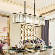 Rectangular clear crystal island pendant light with black metal frame and hanging chains for modern dining rooms