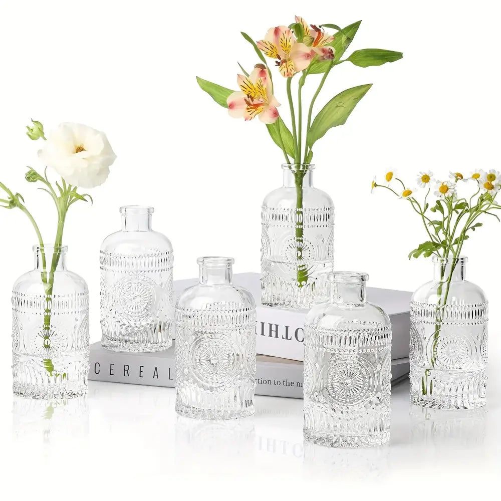 DecorBites™ clear glass bud vases set of 12 with intricate embossed patterns holding various flowers