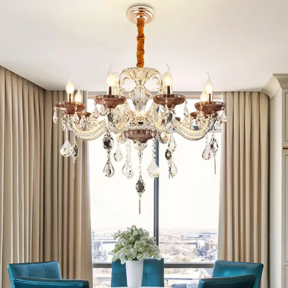 An elegant DecorBites™ clear glass chandelier candelabra with copper-toned accents and crystal accents