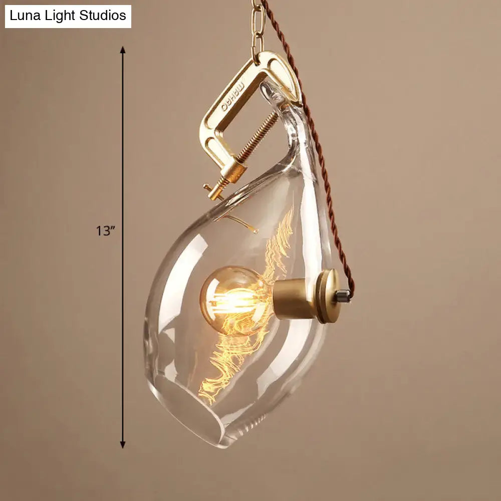 DecorBites™ clear glass fish pendant light with brass clamp and glowing Edison bulb for modern restaurant lighting