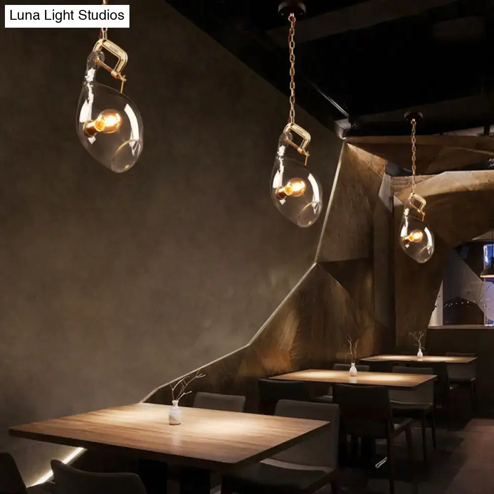 DecorBites™ clear glass fish pendant light with brass hardware and warm bulbs for modern dining spaces