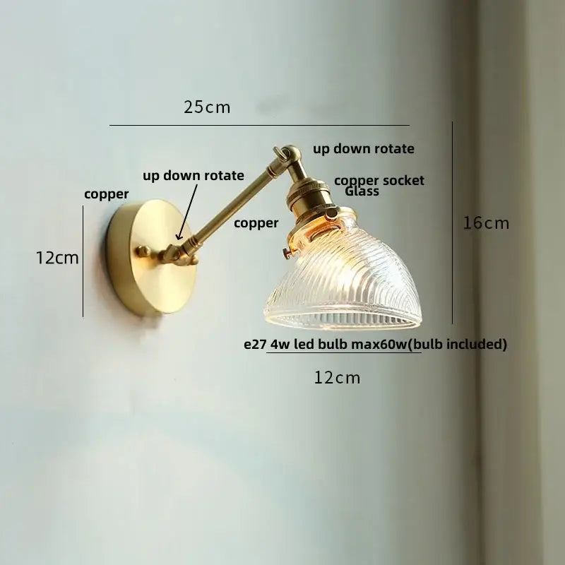 Brass-finished adjustable wall sconce with a ribbed clear glass led shade from decorbites for dining room lighting