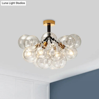 Decorbites™ clear glass semi flush ceiling light with brass accents and black wiring for foyer illumination