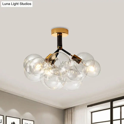 Decorbites clear glass semi flush ceiling light with modern bubble design brass accents for foyer illumination