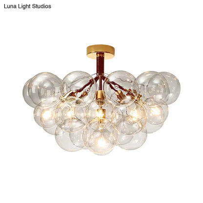 Gold-toned DecorBites semi flush ceiling light with clear glass bubble design for foyer and corridor illumination