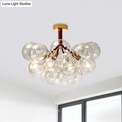 Decorbites clear glass semi flush ceiling light with brass accents and exposed filament bulbs for foyer illumination