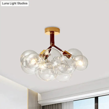 Decorbites clear glass semi flush ceiling light with brass accents and modern bubble design for foyer illumination