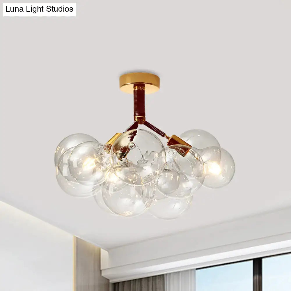Decorbites clear glass semi flush ceiling light with brass accents and bubble design for foyer illumination