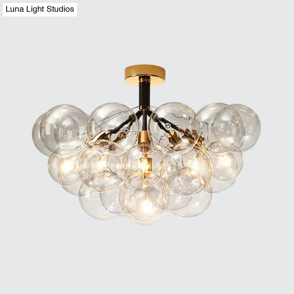 Gold-toned DecorBites™ clear glass semi flush ceiling light with bubble design and exposed filament bulbs for foyer illumination