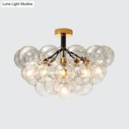 Gold-toned DecorBites™ clear glass semi flush ceiling light with bubble design and exposed filament bulbs for foyer illumination