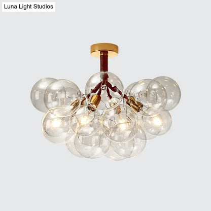 Modern semi flush ceiling light with clear glass bubbles gold-toned metal accents for foyer and corridor illumination