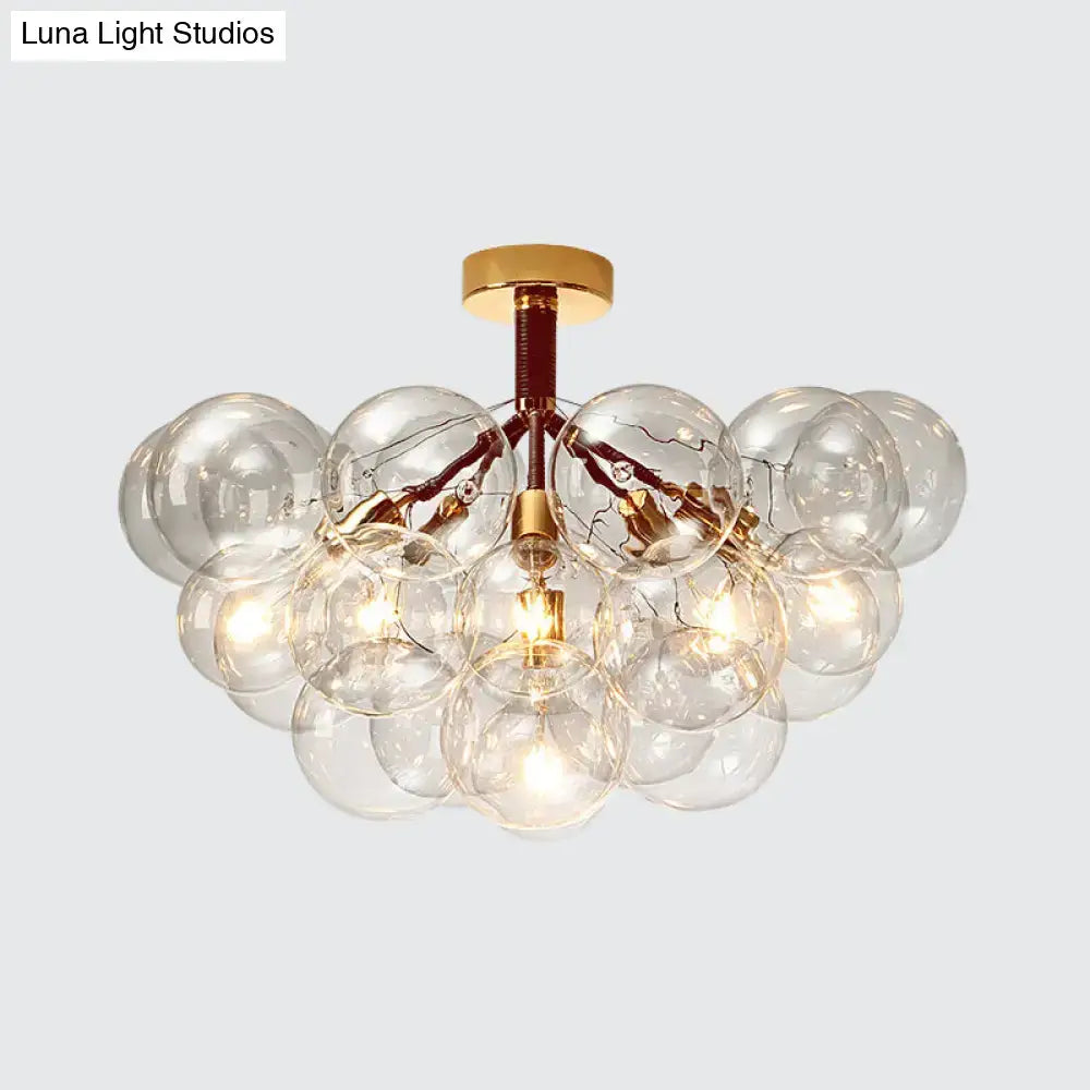 Gold-toned decorbites semi flush ceiling light with clear glass bubble design for foyer and corridor illumination