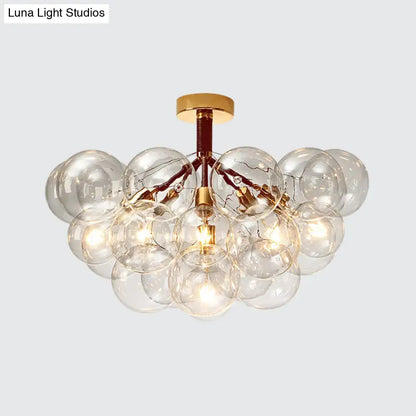 Gold-toned DecorBites™ clear glass semi flush ceiling light with bubble design for foyer and corridor illumination