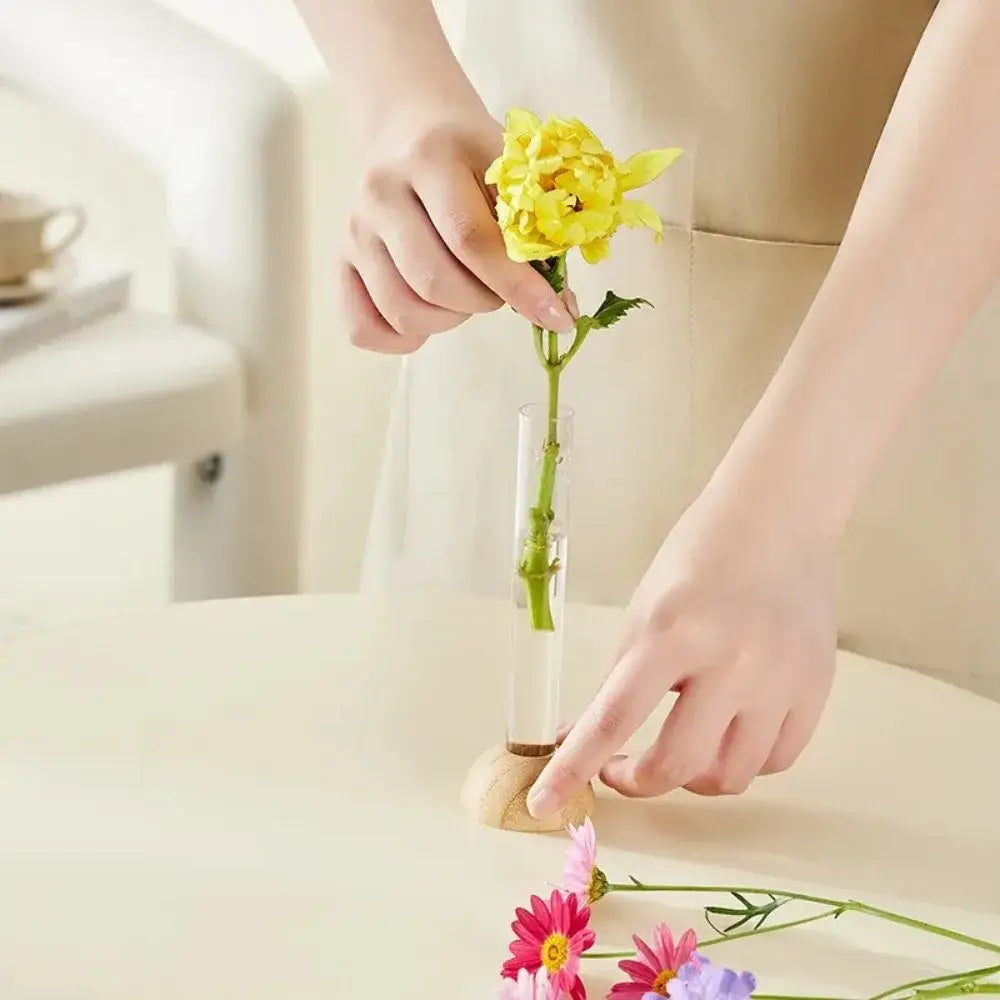 DecorBites clear vase with bamboo base hydroponic vase holding a single yellow flower for tabletop decoration