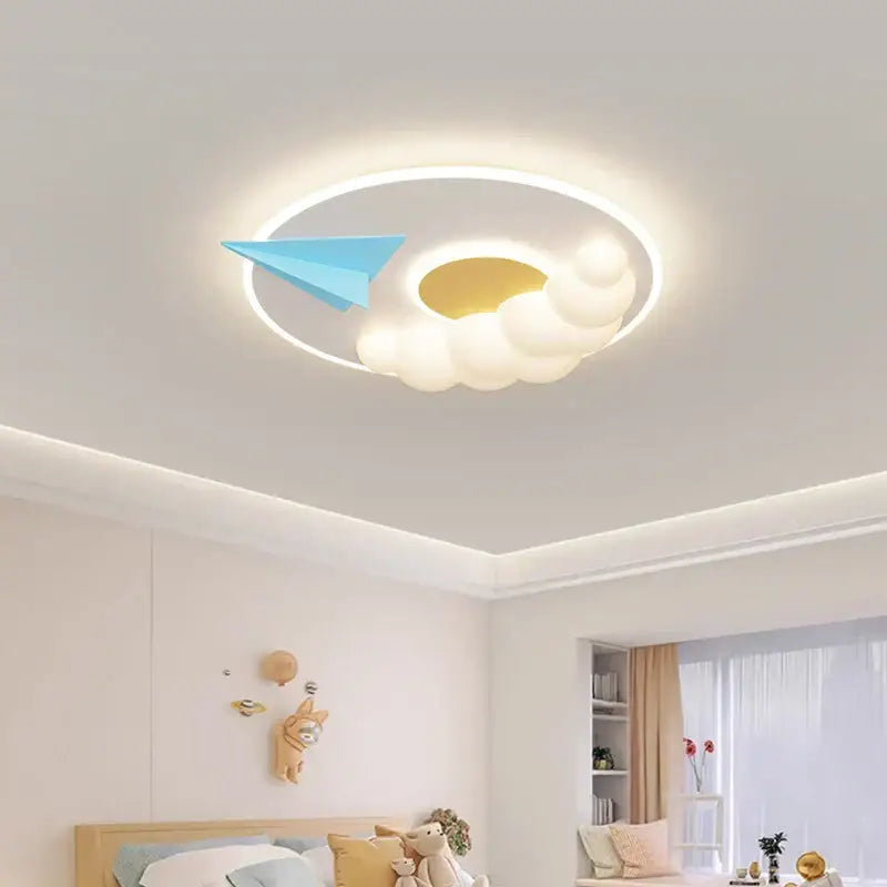 Decorbites cloud airplane chandelier featuring a white cloud shape with a glowing golden center and blue paper airplane detail