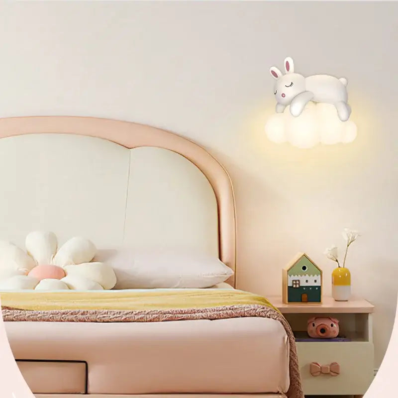 White bunny-shaped decorbites cloud bunny lamp with soft glow resting on a cloud for bedroom wall light