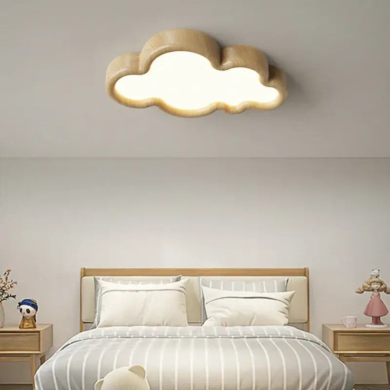 A warm, softly glowing decorbites cloud led chandelier with natural wood finish designed for child room lighting