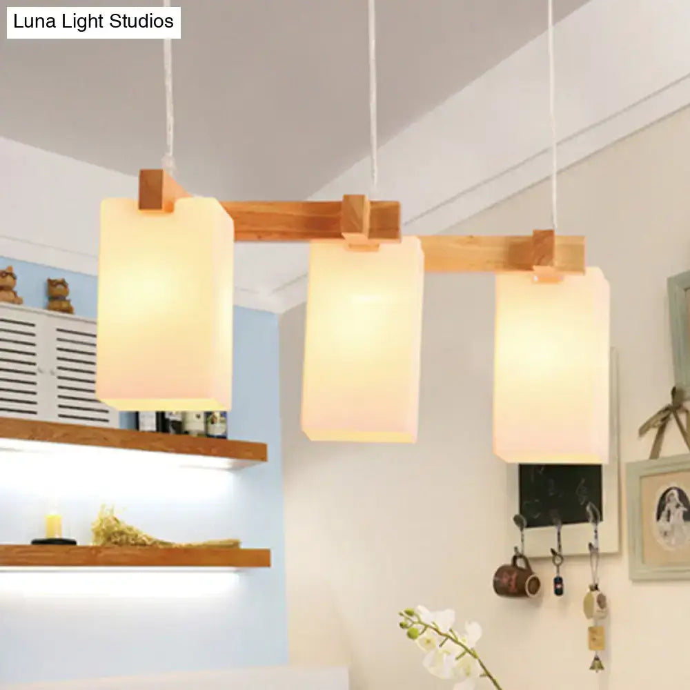 Decorbites cluster pendant kitchen lamp with warm wood frame and white glass shade in modern design with 3 bulbs