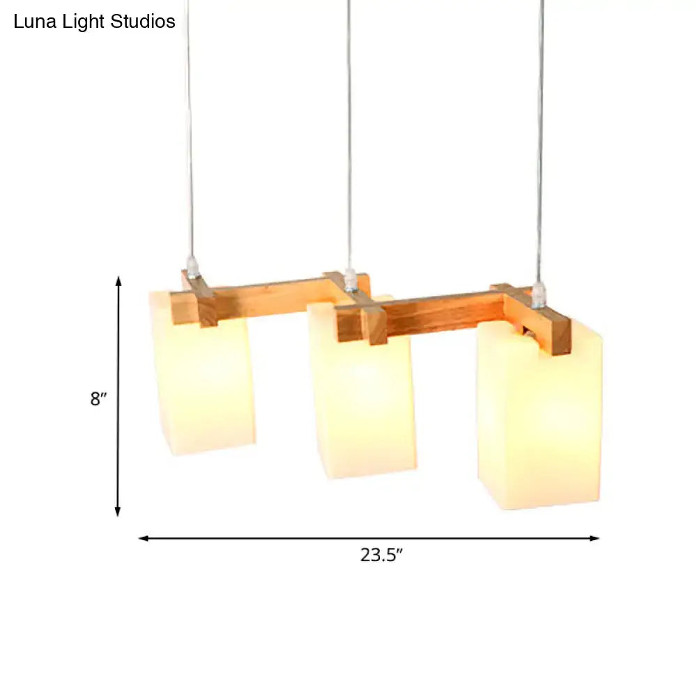 Decorbites cluster pendant kitchen lamp with modern design featuring three warm white glass shades and wooden frame