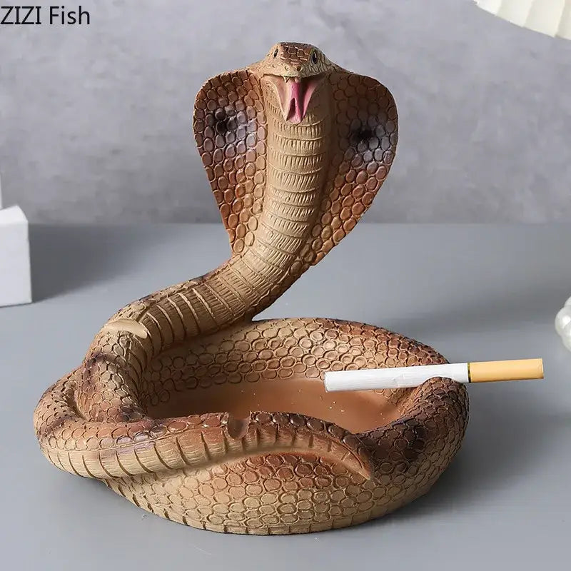 Detailed brown and orange resin decorbites cobra ashtray with textured scales and cigarette holder for office use