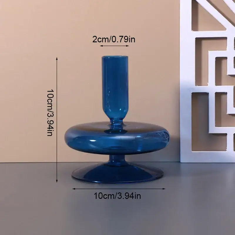 A sleek translucent blue glass vase with a rounded base for stylish home decor by DecorBites™