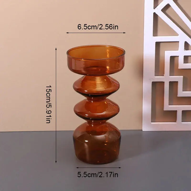 A sleek amber glass vase with a modern tiered design for stylish home decor by decorbites colored glass vase