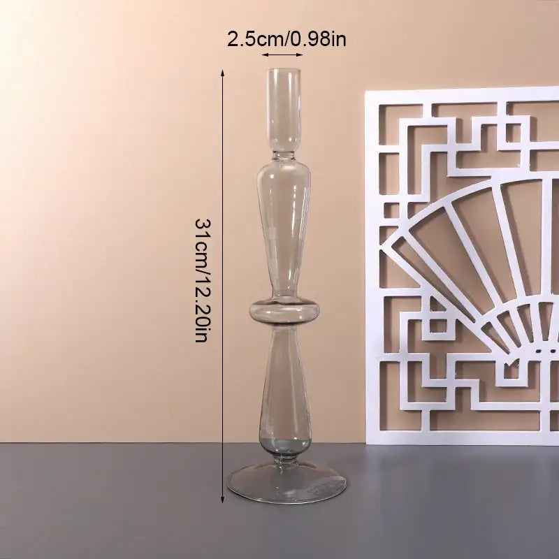 Tall transparent glass vase with slender stem and flared base for stylish home decor by decorbites