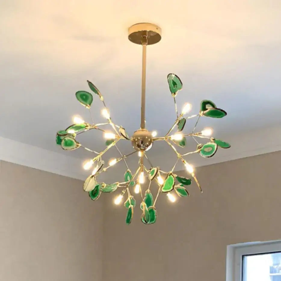 A modern decorbites colorful agate chandelier with gold metal frame and green agate slices for dining room and bedroom